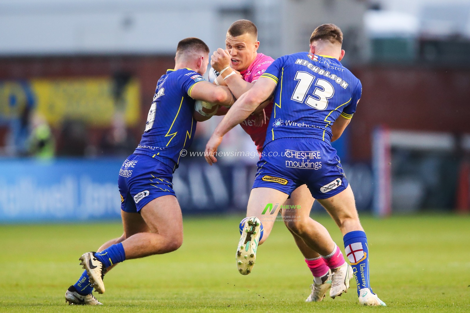 James Batchelor of Hull KR is tackled by Danny Walker of Warrington Wolves during the Betfred Super League Round 11 match Warrington Wolves vs Hull KR at Halliwell Jones Stadium, Warrington, United Kingdom, 9th May 2024

(Photo by Gareth Evans/News Images)