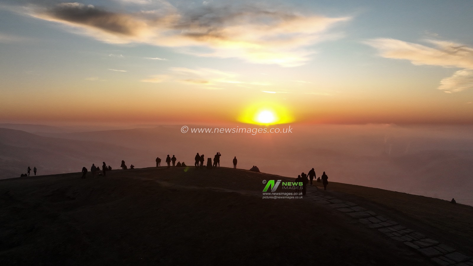 People head to the summit of Mam Tor to watch the sun rise as a blanket of fog lingers over the Hope Valley at Mam Tor, Peak District, United Kingdom, 19th March 2025

(Photo by Mark Cosgrove/News Images)