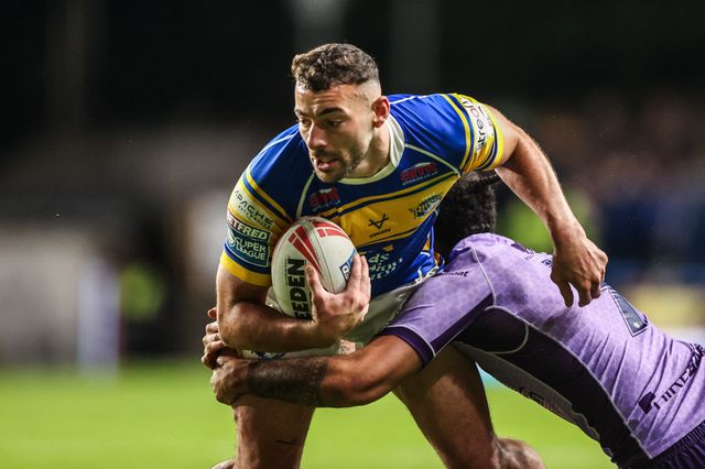 Jake Connor of Leeds Rhinos is tackled by Tyrone May of Hull KR during the Betfred Super League round 23 match Leeds Rhinos vs Hull KR at Headingley Stadium, Leeds, United Kingdom, 21st August 2025

(Photo by Alfie Cosgrove/News Images)