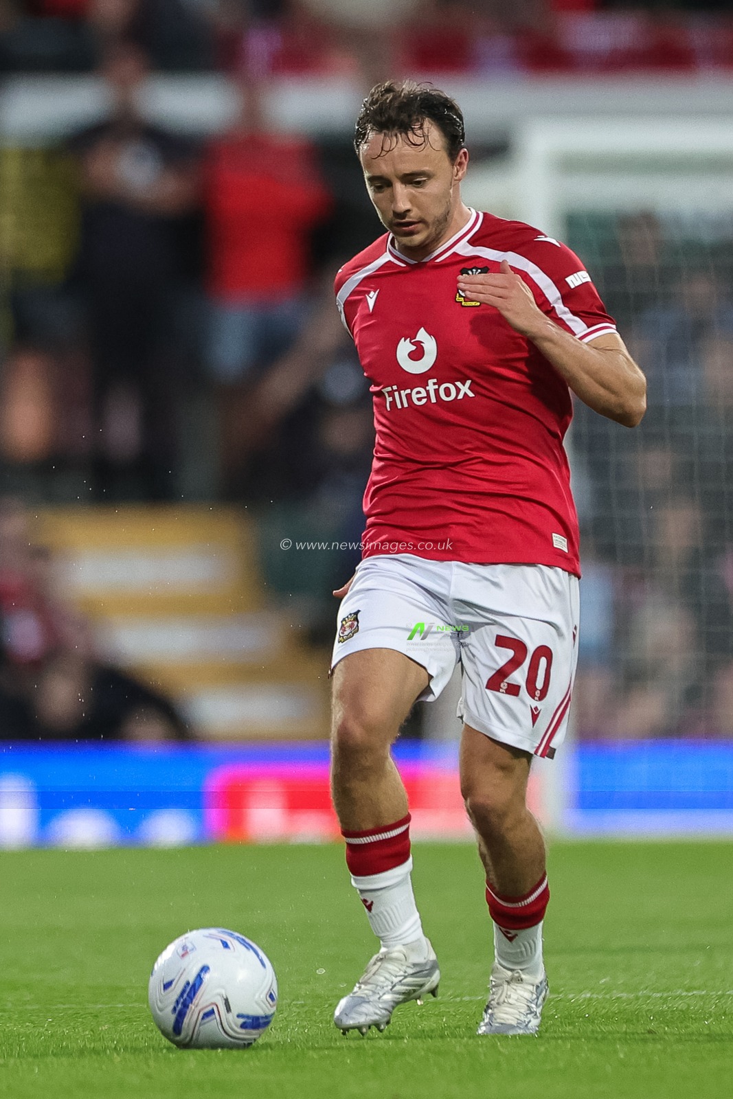 Ollie Rathbone of Wrexham with the ball during the Sky Bet Championship match Wrexham vs Birmingham City at The Racecourse Ground, Wrexham, United Kingdom on 28 August 2026

(Photo by Mark Cosgrove/News Images)