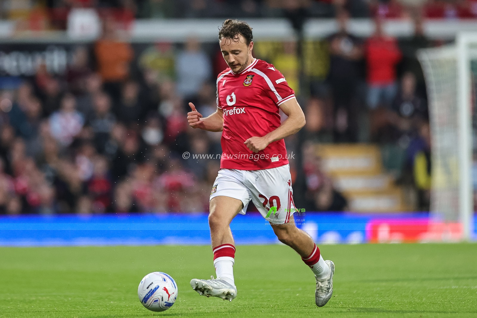 Ollie Rathbone of Wrexham breaks with the ball during the Sky Bet Championship match Wrexham vs Birmingham City at The Racecourse Ground, Wrexham, United Kingdom on 28 August 2026

(Photo by Mark Cosgrove/News Images)