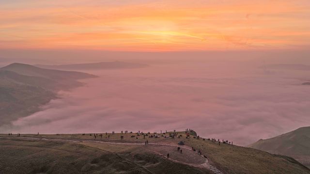 Sunrise hikers walk to the summit of Mam Tor as they watch the sunrise and admire the cloud inversion in the Hope Valley at Mam Tor in the Peak District at Mam Tor, Castleton, United Kingdom on 21 March 2026

(Photo by Mark Cosgrove/News Images)