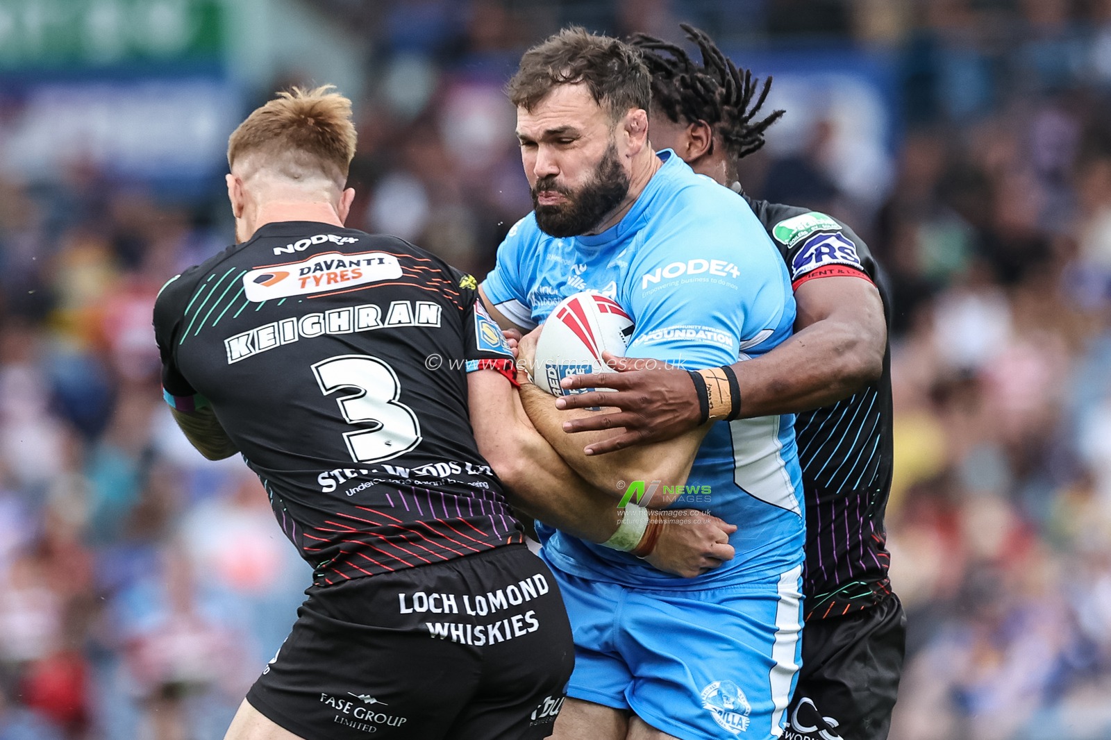 Alex Walmsley of St. Helens is tackled by Adam Keighran of Wigan Warriors and Junior Nsemba of Wigan Warriors during the Magic Weekend match Wigan Warriors vs St Helens at Elland Road, Leeds, United Kingdom, 17th August 2024

(Photo by Mark Cosgrove/News Images)