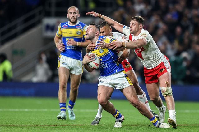 Moses Mbye of St. Helens pulls Jake Connor of Leeds Rhinos to the floor conceding a penalty during the Betfred Super League play-off Eliminator 1 match Leeds Rhinos vs St Helens at Headingley Stadium, Leeds, United Kingdom, 27th September 2025

(Photo by Alfie Cosgrove/News Images)