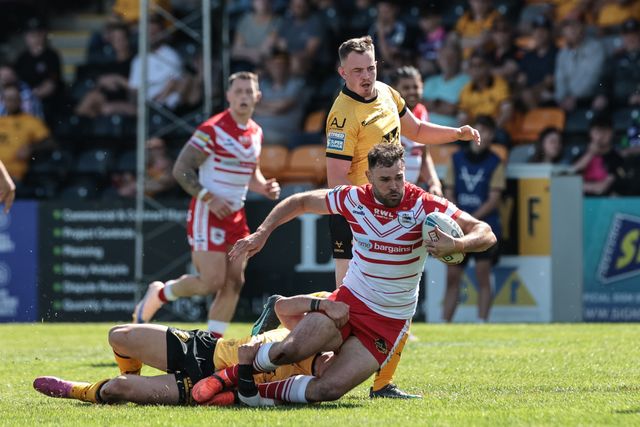Alex Walmsley of St Helens R.F.C. is tackled during the Betfred Super League round 12 match Castleford Tigers vs St Helens at OneBore Stadium, Castleford, Untied Kingdom on 23 May 2026

(Photo by Mark Cosgrove/News Images)