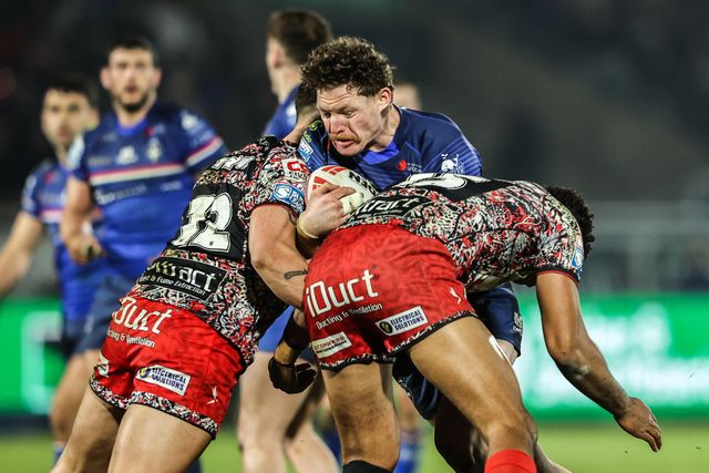 Ky Rodwell of Wakefield Trinity is tackled by Owen Trout of Leigh Leopards and Jacob Alick-Wiencke of Leigh Leopards during the Betfred Super League round 5 match Wakefield Trinity vs Leigh Leopards at DIY Kitchens Stadium, Wakefield, United Kingdom on 20 March 2026

(Photo by Alfie Cosgrove/News Images)