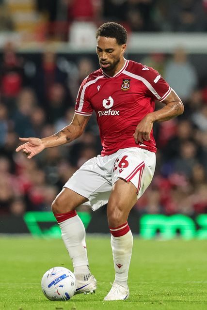 Zak Vyner of Wrexham passes the ball during the Sky Bet Championship match Wrexham vs Birmingham City at The Racecourse Ground, Wrexham, United Kingdom on 28 August 2026

(Photo by Mark Cosgrove/News Images)