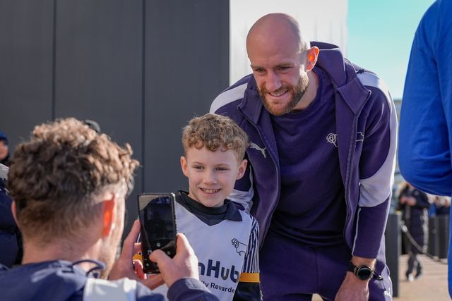 Matthew Clarke of Derby County takes photographs with fans after he arrives at the stadium prior to kick off during the Sky Bet Championship match Derby County vs Swansea City at Pride Park Stadium, Derby, United Kingdom on 14 February 2026

(Photo by Maynard Manyowa/News Images)
