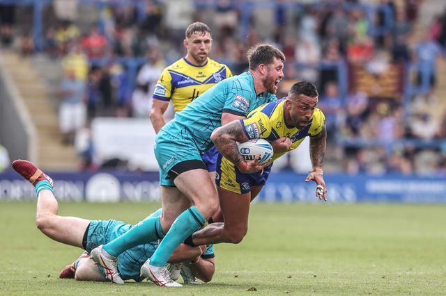 Paul Vaughan of Warrington Wolves is tackled during the Betfred Super League round 15 match Warrington Wolves vs Huddersfield Giants at Halliwell Jones Stadium, Warrington, United Kingdom, 21st June 2025

(Photo by Alfie Cosgrove/News Images)