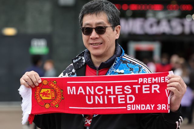 Manchester United fans pose for photos outside Old Trafford during the Premier League match Manchester United vs Liverpool at Old Trafford, Manchester, United Kingdom on 03 May 2026

(Photo by Mark Cosgrove/News Images)