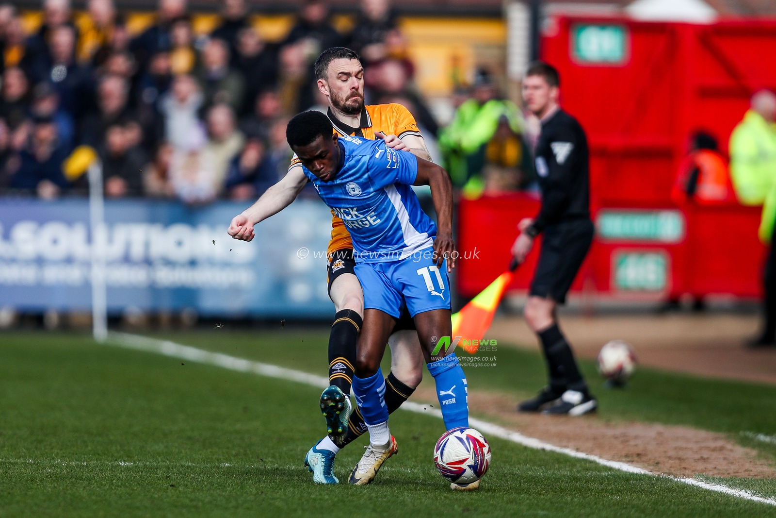 Kwame Poku of Peterborough United is put under pressure by Scott Malone of Cambridge United during the Sky Bet League 1 match Cambridge United vs Peterborough United at Cledara Abbey Stadium, Cambridge, United Kingdom, 15th March 2025

(Photo by Izzy Poles/News Images)