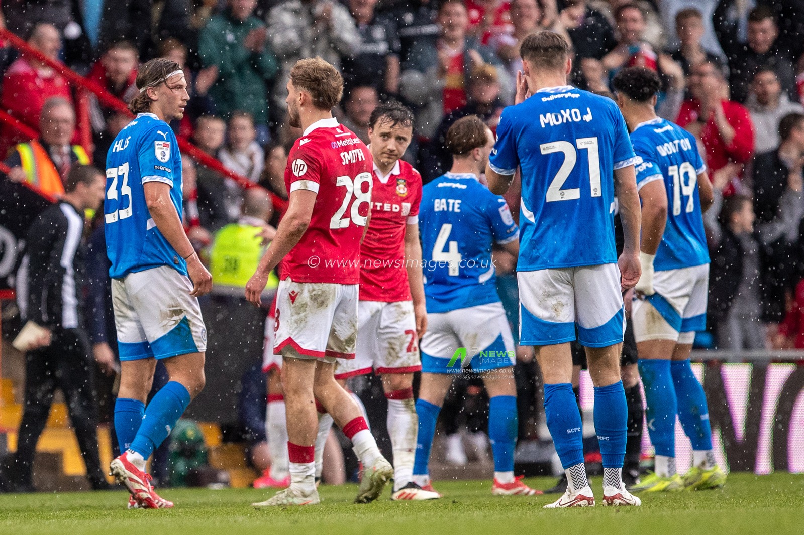 Stockport County's Brad Hills and Wrexham's Sam Smith exchange words during the Sky Bet League 1 match Wrexham vs Stockport County at SToK Cae Ras, Wrexham, United Kingdom, 22nd March 2025

(Photo by Nik Mesney/News Images)
