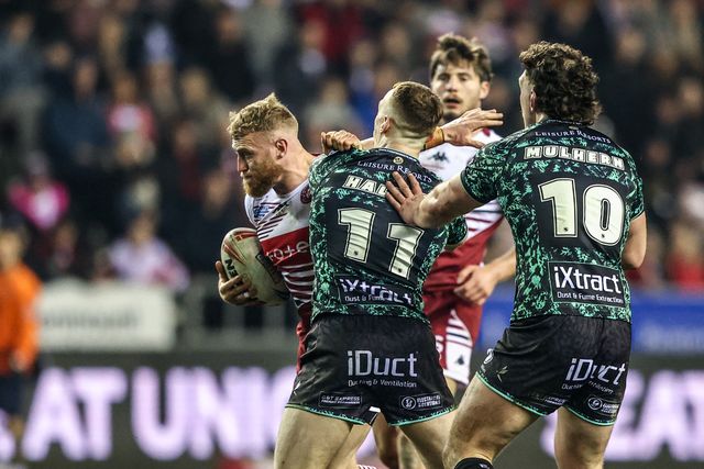 Luke Thompson of Wigan Warriors is tackled by Frankie Halton of Leigh Leopards during the Betfred Super League match Wigan Warriors vs Leigh Leopards at The Brick Community Stadium, Wigan, United Kingdom on 26 February 2026

(Photo by Alfie Cosgrove/News Images)