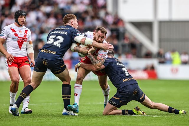 Daryl Clark of St. Helens is tackled during the Betfred Super League round 16 match St Helens vs Salford Red Devils at Totally Wicked Stadium, St Helens, United Kingdom, 29th June 2025

(Photo by Alfie Cosgrove/News Images)
