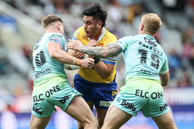 Keenan Palasia of Leeds Rhinos is tackled by Matty Lees of St. Helens and George Delaney of St. Helens during the Betfred Magic Weekend 2025 match St Helens vs Leeds Rhinos at St. James's Park, Newcastle, United Kingdom, 3rd May 2025

(Photo by Mark Cosgrove/News Images)
