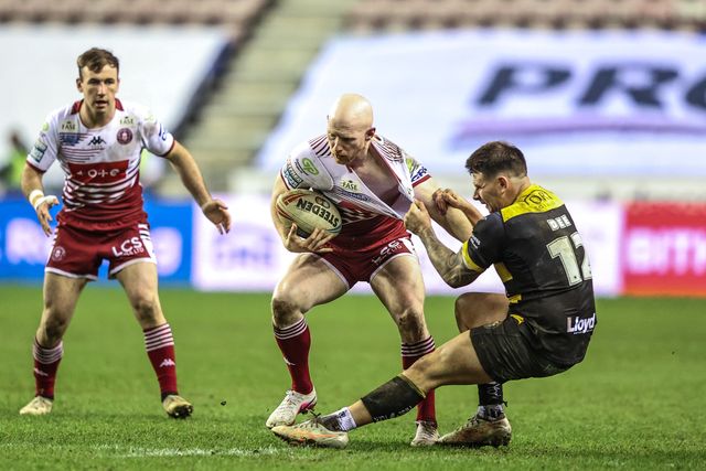 Liam Farrell of Wigan Warriors is tackled by Jesse Dee of York Knights during the Betfred Super League round 5 match Wigan Warriors vs York Knights at The Brick Community Stadium, Wigan, United Kingdom on 19 March 2026

(Photo by Alfie Cosgrove/News Images)