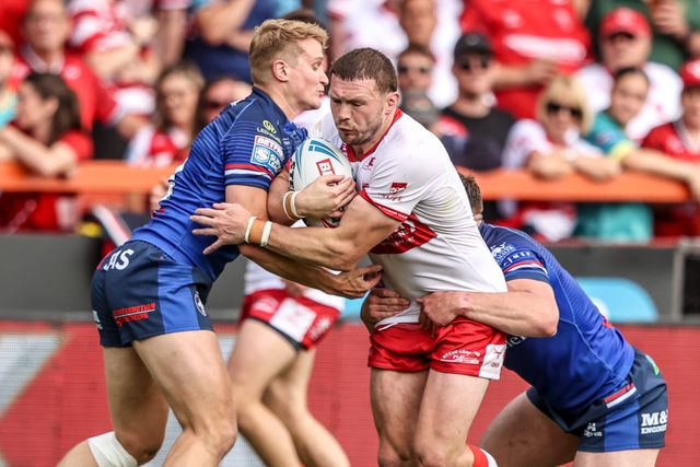 James Batchelor of Hull KR is tackled by Will Tate of Wakefield Trinity and Jake Trueman of Wakefield Trinity during the Betfred Super League round 18 match Hull KR vs Wakefield Trinity at Sewell Group Craven Park, Hull, United Kingdom on 11 July 2026

(Photo by Alfie Cosgrove/News Images)