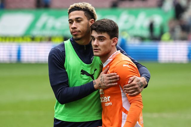 Jordan Lawrence-Gabriel of Blackpool embraces Rob Apter of Blackpool during the Sky Bet League 1 match Wigan Athletic vs Blackpool at The Brick Community Stadium, Wigan, United Kingdom, 26th April 2025

(Photo by Mark Cosgrove/News Images)