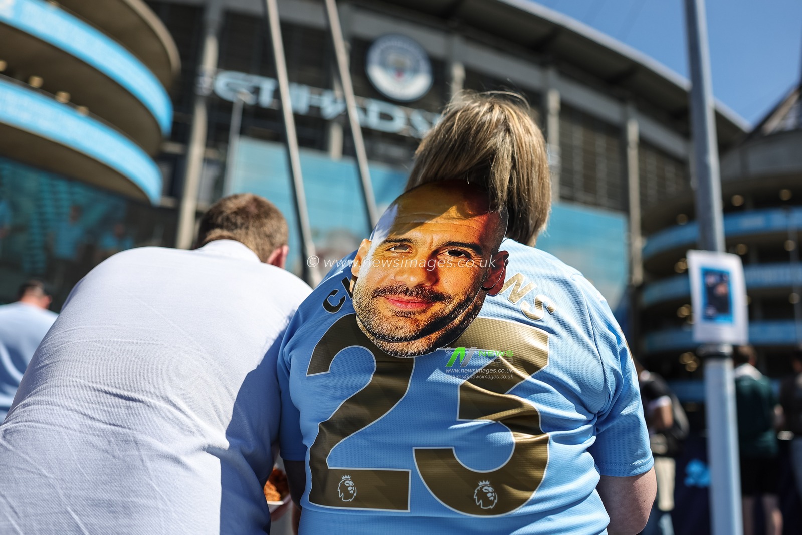 A Man City dan with a Pep Guardiola manager of Manchester City face mask during the Premier League match Manchester City vs Aston Villa at Etihad Stadium, Manchester, United Kingdom on 24 May 2026

(Photo by Mark Cosgrove/News Images)