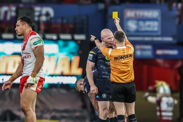 Brad O'neill of Wigan Warriors is given a yellow card by referee  Liam Moore for a dangerous tackle on Tyrone May of Hull KR during the 2025 Betfred Super League Grand Final Hull KR v Wigan Warriors at Old Trafford, Manchester, United Kingdom, 11th October 2025

(Photo by Alfie Cosgrove/News Images)