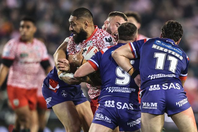 Isaac Liu of Leigh Leopards is tackled by Liam Hood of Wakefield Trinity during the Betfred Super League play-off Eliminator 1 match Leigh Leopards vs Wakefield Trinity at Progress With Unity Stadium, Leigh, United Kingdom, 26th September 2025

(Photo by Alfie Cosgrove/News Images)
