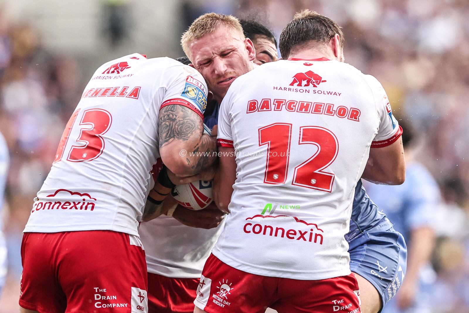 Mikołaj Olędzki of Leeds Rhinos is tackled by Elliot Minchella of Hull KR and James Batchelor of Hull KR during the Betfred Super League round 16 match Leeds Rhinos vs Hull KR at AMT Headingley Stadium, Leeds, United Kingdom on 26 June 2026

(Photo by Alfie Cosgrove/News Images)