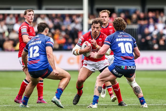 Jai Whitbread of Hull KR is tackled by Matty Storton of Wakefield Trinity and Ky Rodwell of Wakefield Trinity during the Betfred Super League round 13 match Wakefield Trinity vs Hull KR at DIY Kitchens Stadium, Wakefield, United Kingdom on 06 June 2026

(Photo by Alfie Cosgrove/News Images)
