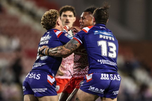 Tesi Niu of Leigh Leopards is tackled during the Betfred Super League play-off Eliminator 1 match Leigh Leopards vs Wakefield Trinity at Progress With Unity Stadium, Leigh, United Kingdom, 26th September 2025

(Photo by Alfie Cosgrove/News Images)