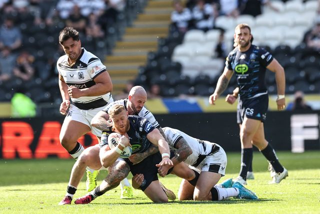 Luke Thompson of Wigan Warriors is tackled by Zak Hardaker of Hull FC during the Betfred Super League Round 9 match Hull FC vs Wigan Warriors at MKM Stadium, Hull, United Kingdom, 27th April 2025

(Photo by Mark Cosgrove/News Images)
