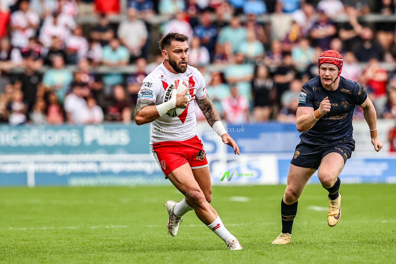 Kyle Feldt of St. Helens breaks with the ball during the Betfred Super League round 16 match St Helens vs Salford Red Devils at Totally Wicked Stadium, St Helens, United Kingdom, 29th June 2025

(Photo by Alfie Cosgrove/News Images)