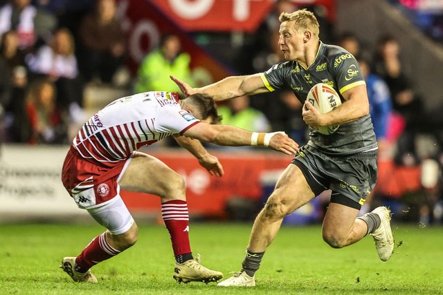 Lachie Miller of Leeds Rhinos is tackled by Harry Smith of Wigan Warriors during the Betfred Super League round 11 match Wigan Warriors vs Leeds Rhinos at The Brick Community Stadium, Wigan, United Kingdom on 15 May 2026

(Photo by Alfie Cosgrove/News Images)