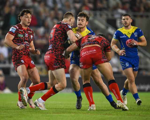Jordy Crowther of Warrington Wolves is tackled by Matt Davis of Leigh Leopards and Edwin Ipape of Leigh Leopards during the Betfred Super League Round 24 match Leigh Leopards vs Warrington Wolves at Leigh Sports Village, Leigh, United Kingdom, 30th August 2024

(Photo by Craig Thomas/News Images)
