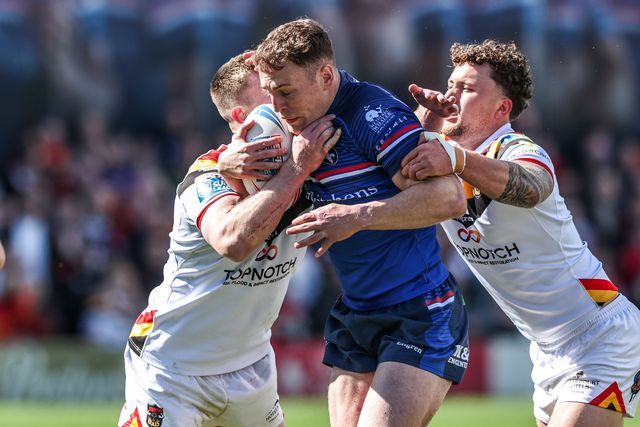 Jake Trueman of Wakefield Trinity is tackled by Loghan Lewis of Bradford Bulls and Leon Ruan of Bradford Bulls during the Betfred Super League round 8 match Wakefield Trinity vs Bradford Bulls at DIY Kitchens Stadium, Wakefield, United Kingdom on 18 April 2026

(Photo by Alfie Cosgrove/News Images)
