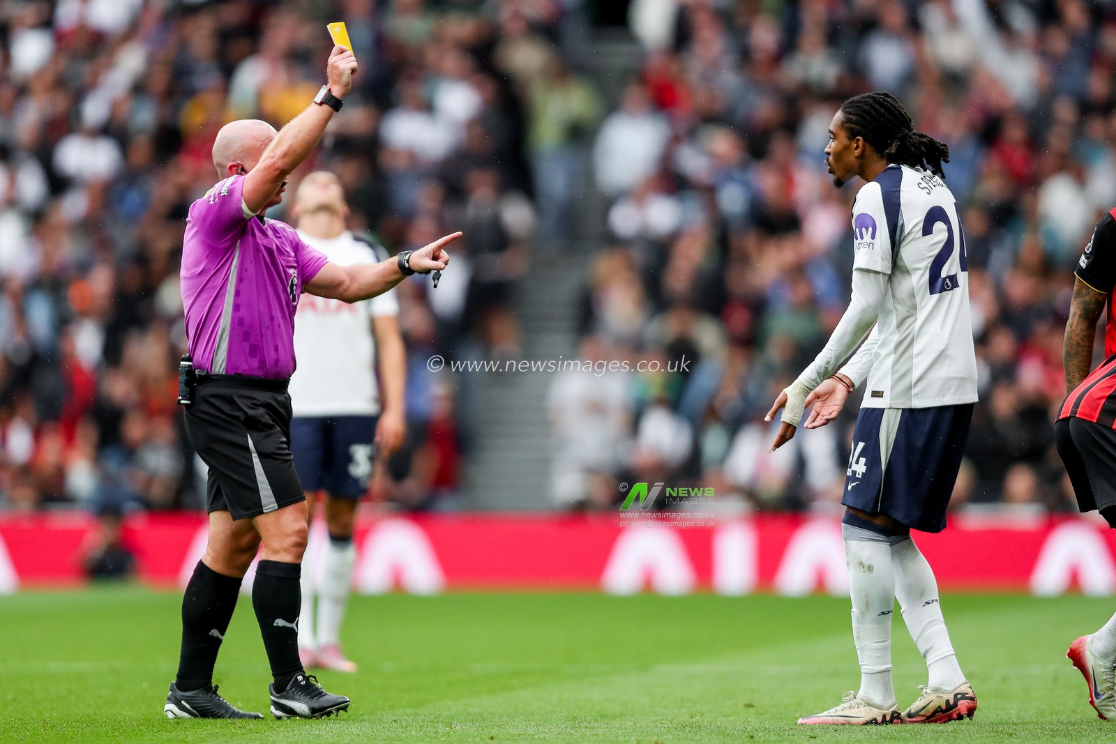 Referee Simon Hooper shows Djed Spence of Tottenham Hotspur a yellow card during the Premier League match Tottenham Hotspur vs Bournemouth at Tottenham Hotspur Stadium, London, United Kingdom, 30th August 2025

(Photo by Izzy Poles/News Images)
