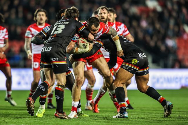 David Klemmer of St Helens is tackled by Joe Mellor of Bradford Bulls and Eribe Doro of Bradford Bulls during the Betfred Super League round 4 match St Helens vs Bradford Bulls at The BrewDog Stadium, St Helens, United Kingdom on 07 March 2026

(Photo by Alfie Cosgrove/News Images)