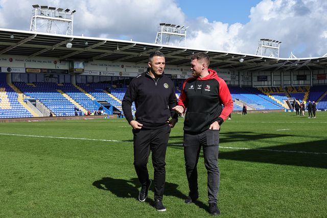 Sam Burgess head coach of Warrington Wolves and Scott Taylor head coach of Goole Vikings speak as the walk out on the pitch during the Betfred Challenge Cup round 4 match Goole Vikings vs Warrington Wolves at The Halliwell Jones Stadium, Warrington, United Kingdom on 14 March 2026

(Photo by Mark Cosgrove/News Images)