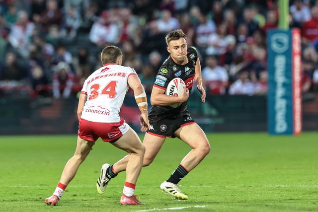 Charlie Yeomens of Wigan Warriors looks to pass Ryan Hampshire of Hull KR  during the Betfred Super League round 12 match Hull KR vs Wigan Warriors at Sewell Group Craven Park, Hull, United Kingdom on 21 May 2026

(Photo by Mark Cosgrove/News Images)