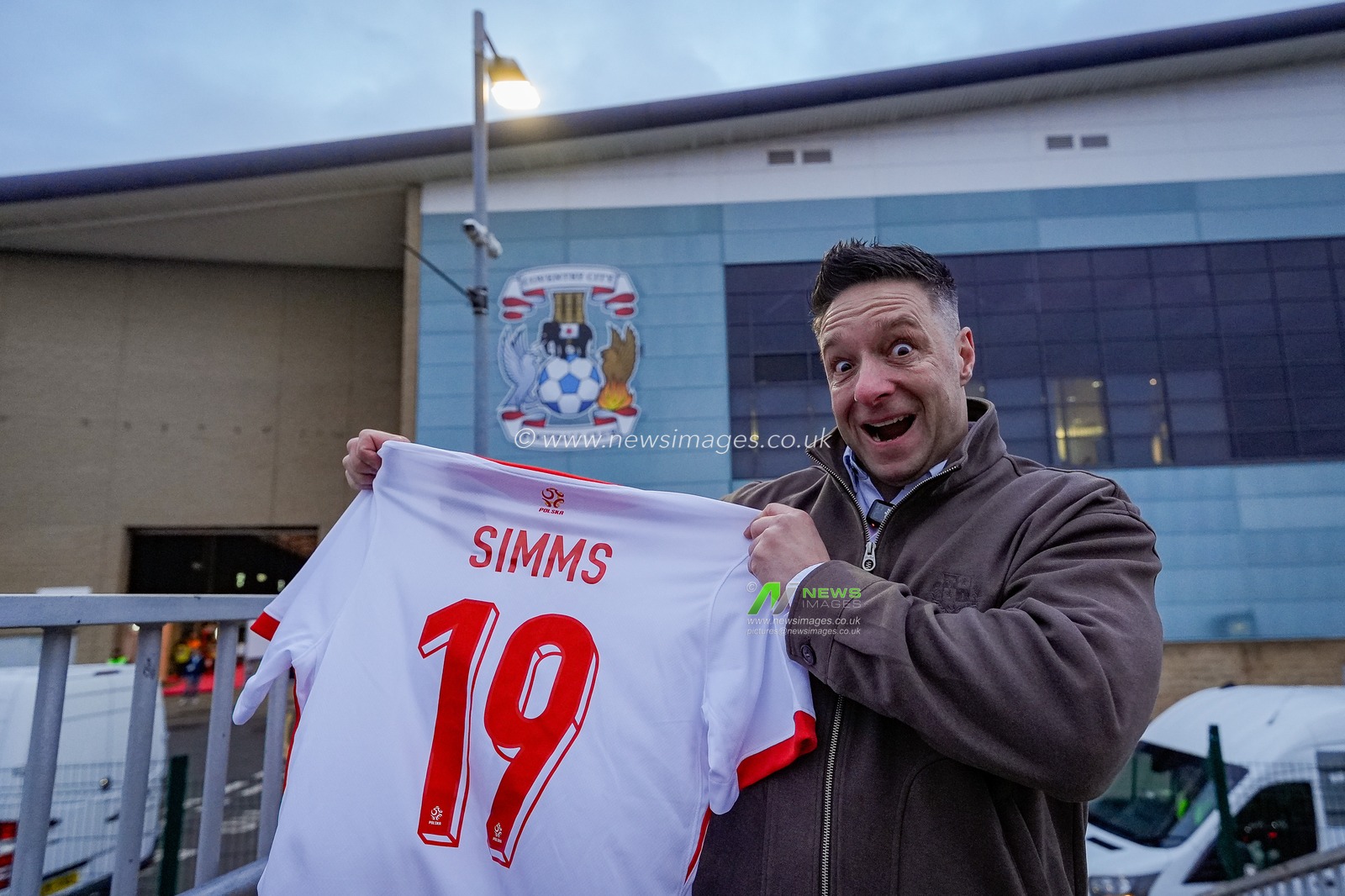 Polish YouTuber Huberto News holds up a shirt of  Ellis Simms of Coventry City outside the ground during the Sky Bet Championship match Coventry City vs Millwall at Coventry Building Society Arena, Coventry, United Kingdom, 20th January 2026

(Photo by Maynard Manyowa/News Images)