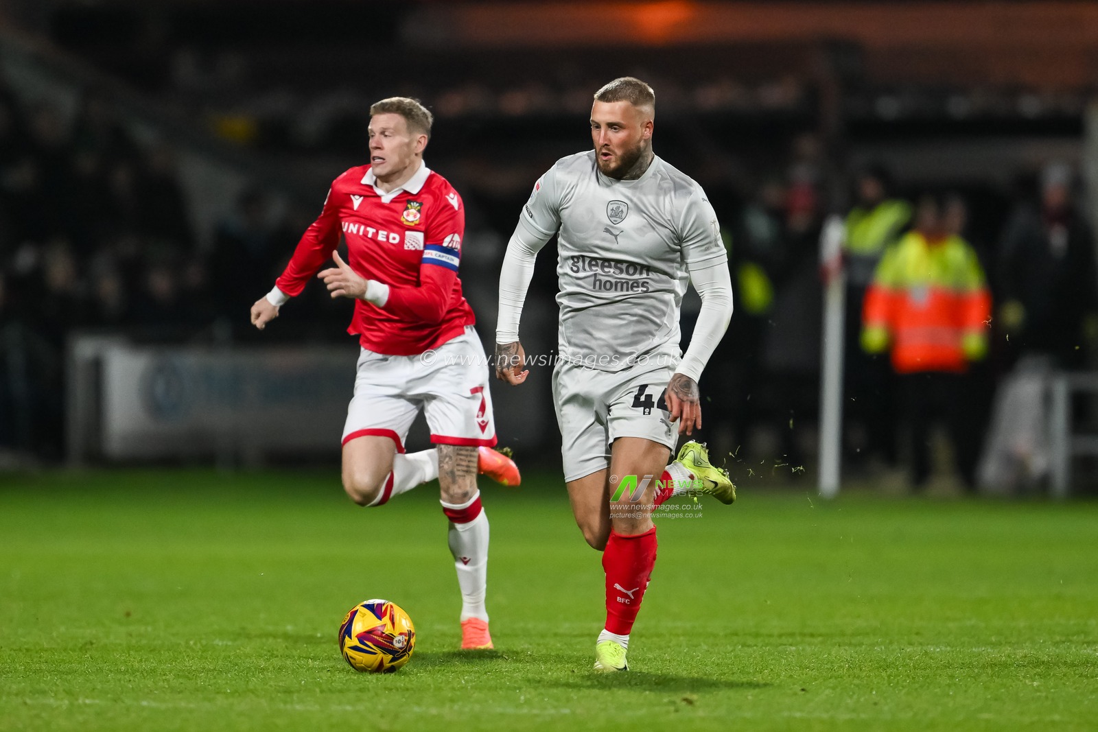 Stephen Humphrys of Barnsley makes a break with the ball  during the Sky Bet League 1 match Wrexham vs Barnsley at SToK Cae Ras, Wrexham, United Kingdom, 3rd December 2024

(Photo by Craig Thomas/News Images)