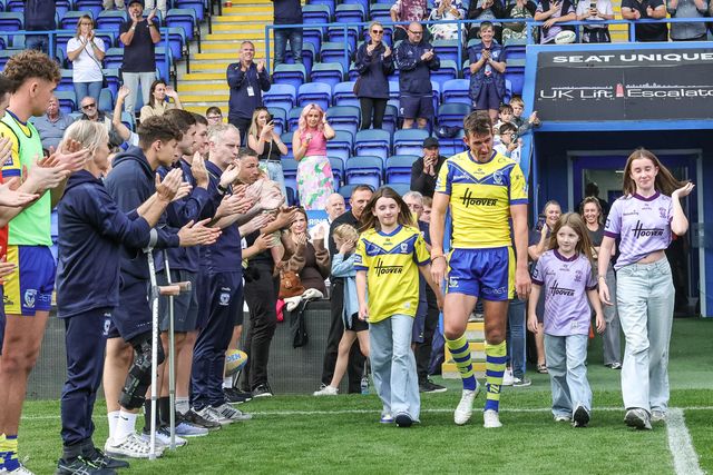 Stefan Ratchford of Warrington Wolves walks out for one last time as players and staff form a guard of honour on his last ever home game as he announces his retirement during the Betfred Super League Round 25 match Warrington Wolves vs Leigh Leopards at Halliwell Jones Stadium, Warrington, United Kingdom, 6th September 2025

(Photo by Mark Cosgrove/News Images)