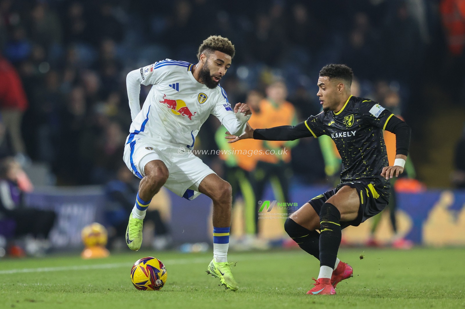 Jayden Bogle of Leeds United and Lewis Dobbin of Norwich City battle for the ball during the Sky Bet Championship match Leeds United vs Norwich City at Elland Road, Leeds, United Kingdom, 22nd January 2025

(Photo by Alfie Cosgrove/News Images)