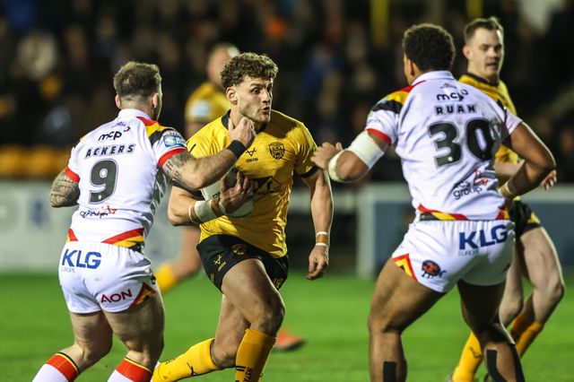 George Lawler of Castleford Tigers is tackled by Andy Ackers of Bradford Bulls and Leon Ruan of Bradford Bulls during the Betfred Super League round 6 match Castleford Tigers vs Bradford Bulls at OneBore Stadium, Castleford, Untied Kingdom on 26 March 2026

(Photo by Alfie Cosgrove/News Images)