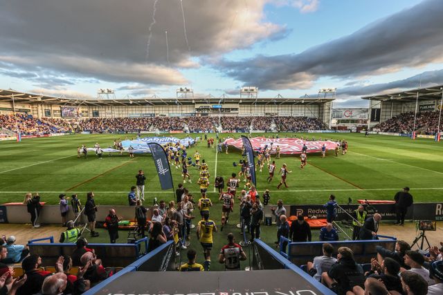 The teams come out for the game during the Betfred Super League round 21 match Warrington Wolves vs Wigan Warriors at Halliwell Jones Stadium, Warrington, United Kingdom, 8th August 2025

(Photo by Alfie Cosgrove/News Images)