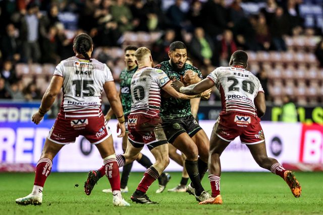 Isaac Liu of Leigh Leopards is tackled by Luke Thompson of Wigan Warriors and Sam Eseh of Wigan Warriors during the Betfred Super League match Wigan Warriors vs Leigh Leopards at The Brick Community Stadium, Wigan, United Kingdom on 26 February 2026

(Photo by Alfie Cosgrove/News Images)