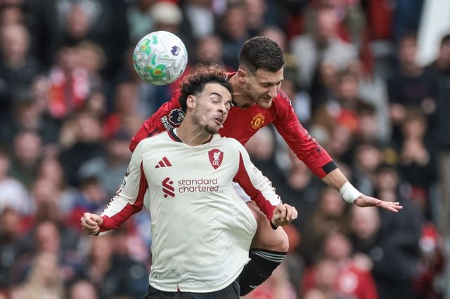 Diogo Dalot of Manchester United jumps up to win the high ball from Curtis Jones of Liverpool during the Premier League match Manchester United vs Liverpool at Old Trafford, Manchester, United Kingdom on 03 May 2026

(Photo by Mark Cosgrove/News Images)