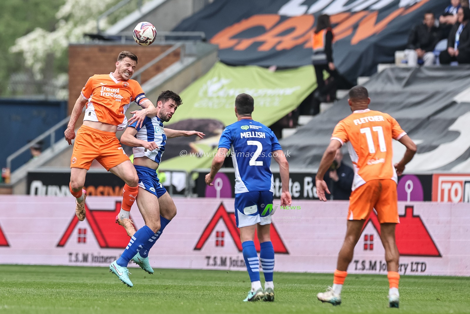 Lee Evans of Blackpool jumps up to win the high ball during the Sky Bet League 1 match Wigan Athletic vs Blackpool at The Brick Community Stadium, Wigan, United Kingdom, 26th April 2025

(Photo by Mark Cosgrove/News Images)
