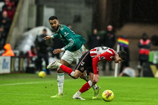 Cody Gakpo of Liverpool and Trai Hume of Sunderland battle for the ball during the Premier League match Sunderland vs Liverpool at Stadium Of Light, Sunderland, United Kingdom on 11 February 2026

(Photo by Alfie Cosgrove/News Images)