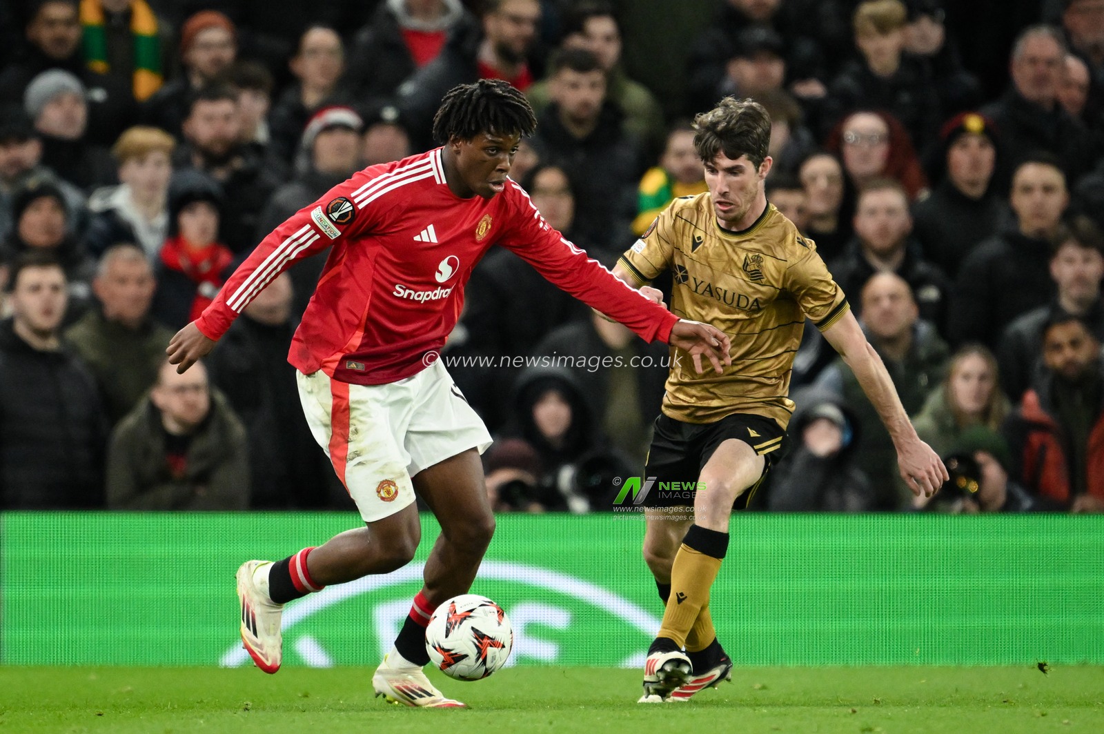 Patrick Dorgu of Manchester United with the ball during the UEFA Europa League Last 16 match Manchester United vs Real Sociedad at Old Trafford, Manchester, United Kingdom, 13th March 2025

(Photo by Craig Thomas/News Images)