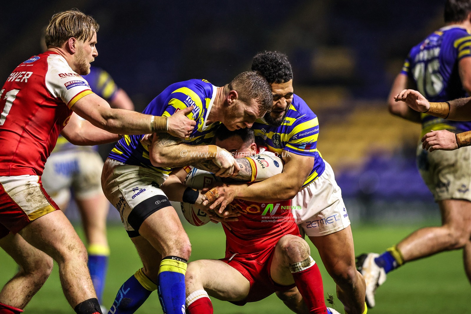Marc Sneyd of Warrington Wolves and Kelepi Tanginoa of Warrington Wolves make a tackle during the Betfred Challenge Cup match Warrington Wolves vs Sheffield Eagles at The Halliwell Jones Stadium, Warrington, United Kingdom on 06 February 2026

(Photo by Alfie Cosgrove/News Images)
