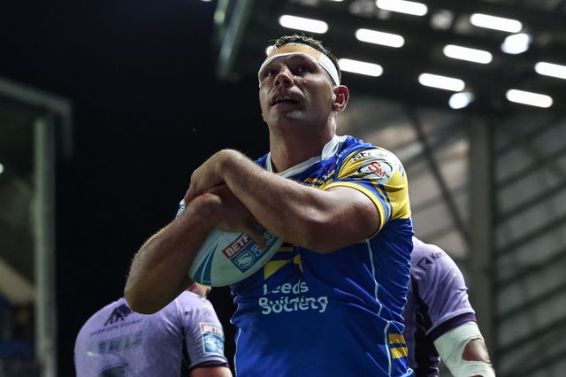 Ryan Hall of Leeds Rhinos holds the ball after a thwarted Joe Burgess of Hull KR try attempt during the Betfred Super League round 23 match Leeds Rhinos vs Hull KR at Headingley Stadium, Leeds, United Kingdom, 21st August 2025

(Photo by Mark Cosgrove/News Images)